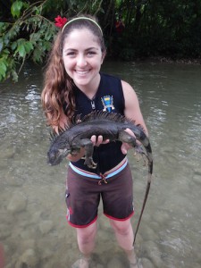 Maravilla holds up a prize Iguana. 